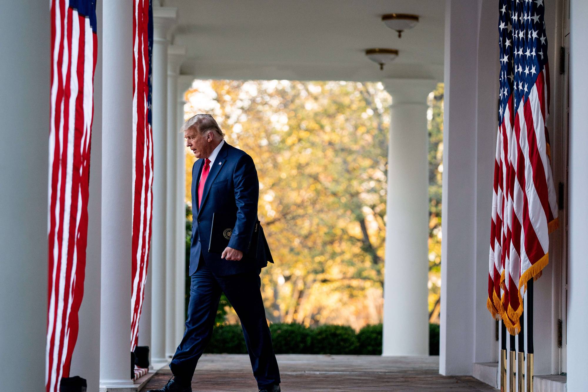 President Donald Trump walks to the Rose Garden of the White House on Friday. | Anna Moneymaker / The New York Times