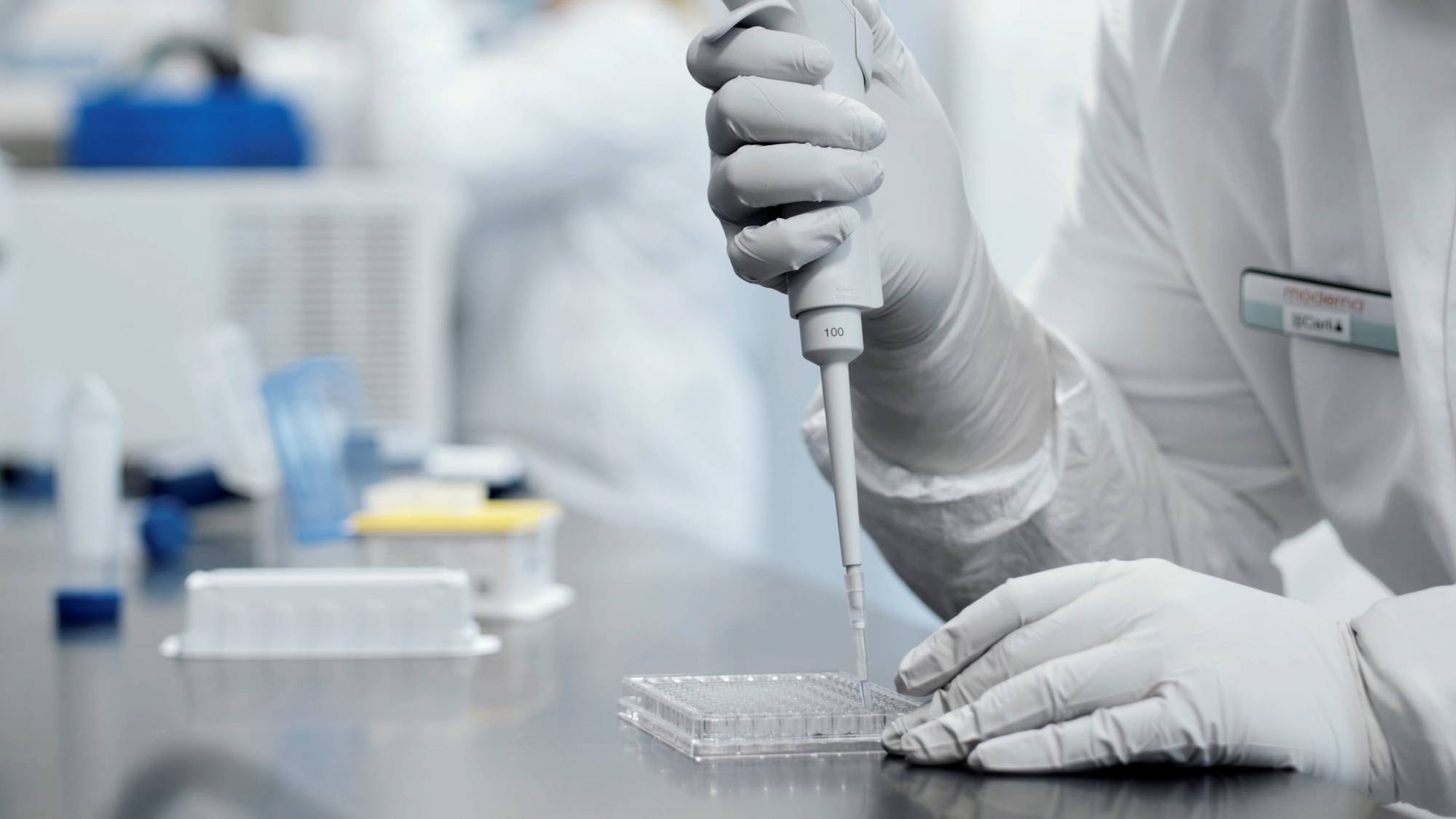 A researcher works in a lab run by Moderna Inc.  | MODERNA INC. / VIA REUTERS