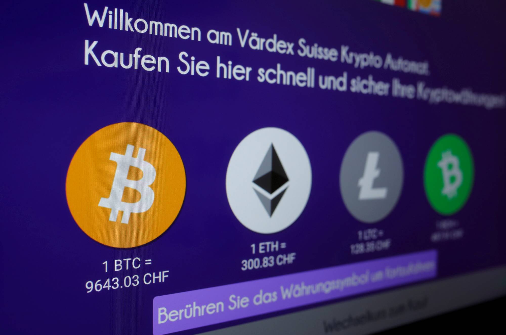 The exchange rates and logos of Bitcoin, Ether, Litecoin and Bitcoin Cash are displayed on a cryptocurrency ATM of blockchain payment service provider Vaerdex at the headquarters of Swiss Falcon Private Bank in Zurich in May 2019. | REUTERS
