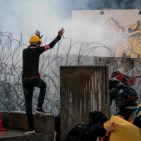 Pro-democracy protesters take part in an anti-government rally near the Thai parliament in Bangkok on Tuesday.  | AFP-JIJI