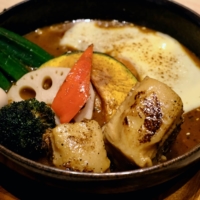 Pig out: Soup Curry Garaku’s pork belly is charred, tender and laced with just the right amount of fat. | FLORENTYNA LEOW

