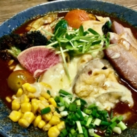 Pony up: No bowl at Ponipirica would be complete without the addition of tappuri-yasai (“lots of vegetables”) and a blanket of cheese. | FLORENTYNA LEOW
