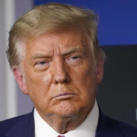 U.S. President Donald Trump listens during an event in the briefing room of the White House on Friday.  | AP