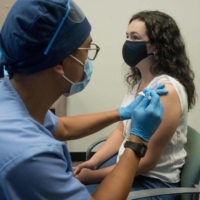 A volunteer is given the Moderna mRNA-1273 Coronavirus Efficacy vaccine in Detroit on Aug. 5. | HENRY FORD HEALTH SYSTEM / VIA AFP-JIJI 