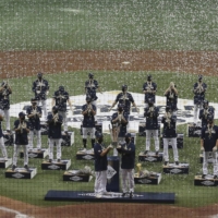 NC Dinos players celebrate after winning the 2020 Korean Series, the Korea Baseball Organization\'s championship round, against the Doosan Bears following Game 6 at Gocheok Sky Dome in Seoul on Tuesday. | AP