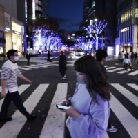 People walk in the Sakae entertainment district of Nagoya last week. | KYODO