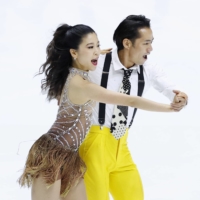 Daisuke Takahashi (right) and Kana Muramoto perform during the NHK Trophy on Friday in Osaka. | KYODO