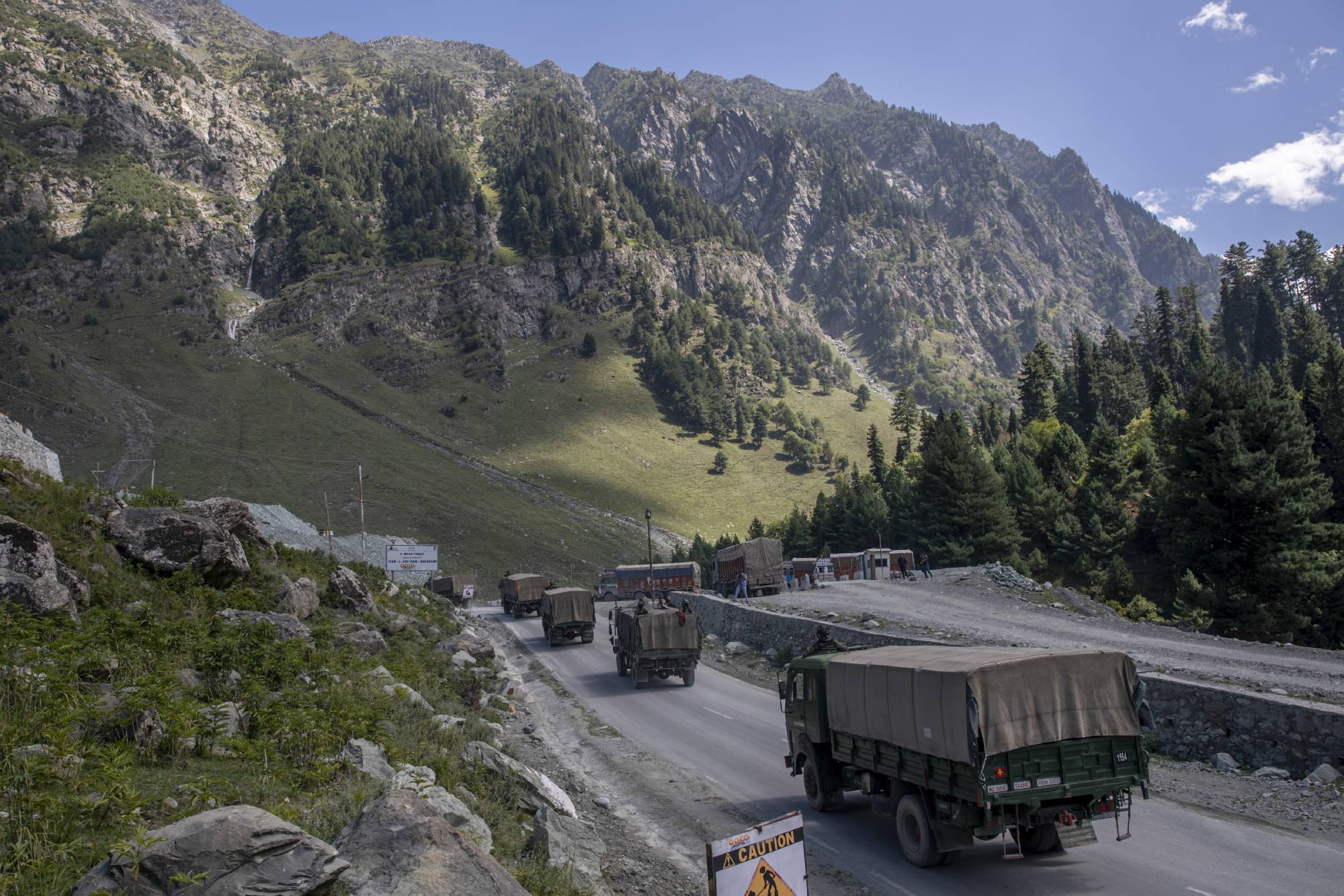 An Indian army convoy moves on a highway northeast of Srinagar in Indian-controlled Kashmir. This year, China’s military built up forces in the Himalayas and crossed into territory that India claimed was on its side of the de facto border.  | AP