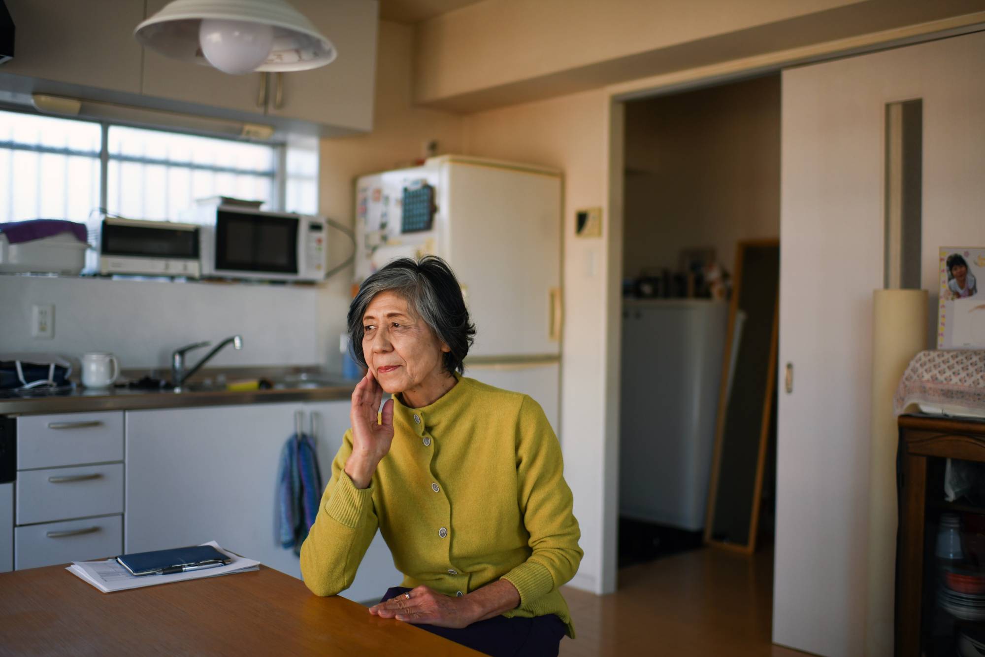 Setsuko Hikita at her home in Tokyo on Nov. 15. Hikita sued her employer for paying her less than many of her co-workers and denying her a retirement allowance. | NORIKO HAYASHI / THE NEW YORK TIMES
