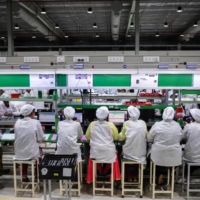 Mobile phones are tested at Rising Stars Mobile India Pvt., a unit of Foxconn Technology Co., in Sriperumbudur, India, last year. | BLOOMBERG 