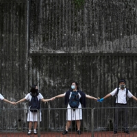 Students form a human chain in Hong Kong in September 2019.  | REUTERS 