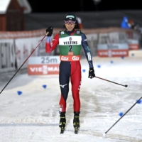 Akito Watabe celebrates after finishing third in the Nordic combined event at the FIS World Cup Ruka Nordic event in Kuusamo, Finland, on Saturday. | LEHTIKUVA / VIA AP