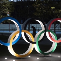 The  postponement costs for the Tokyo Games include payments to staff as well as the introduction of new systems for refunding tickets but do not include measures against the spread of the coronavirus, the newspaper said. | AP