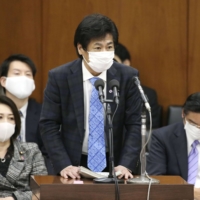 Health minister Norihisa Tamura is calling on municipalities to secure hospital beds for COVID-19 patients as serious cases spike across the nation. | KYODO