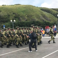 A photo provided by a local resident of Etorofu island in the Northern Territories shows Russian soldiers marching on the island on Sept. 3 to commemorate the 75th anniversary of the victory against Japan in World War II. | KYODO
