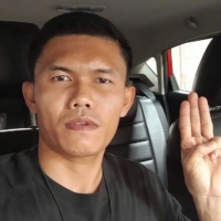 Former Thai Army Sergeant Ekkachai Wangkaphan does the three-fingered salute of anti-government protesters. | EKKACHAI WANGKAPHAN / VIA REUTERS