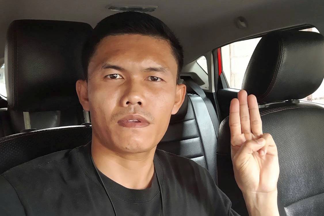 Former Thai Army Sergeant Ekkachai Wangkaphan does the three-fingered salute of anti-government protesters. | Ekkachai Wangkaphan / via REUTERS