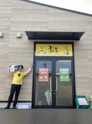 Food support: Kenichi Narita stands in front of the recently opened Kitanagase Community Fridge in Okayama, the first such community fridge in Japan. | COURTESY OF KENICHI NARITA