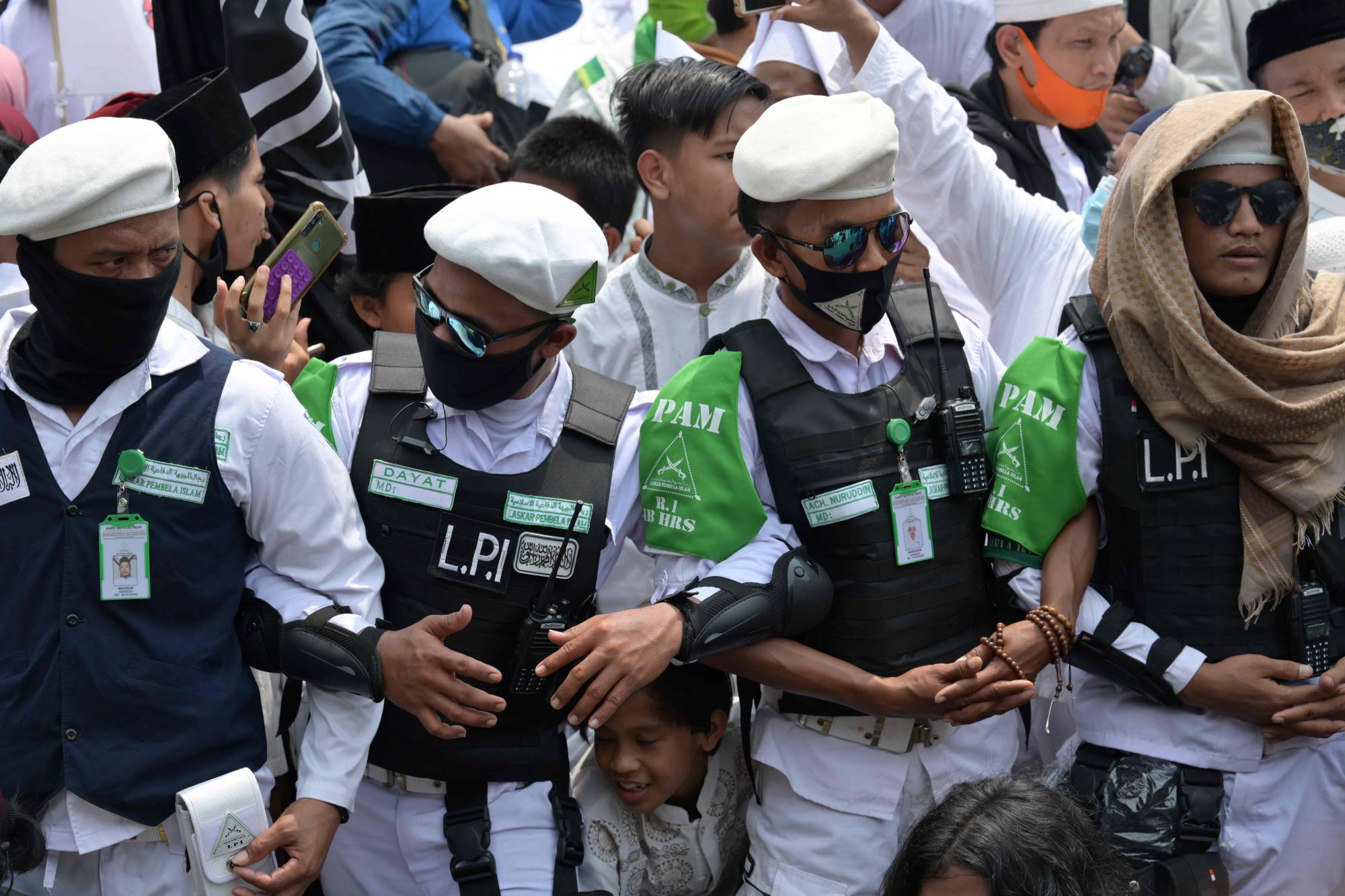 Supporters of Rizieq Shihab, leader of the Islamic Defenders Front, gather at the organization's headquarters in Jakarta on Nov. 10. | AFP-JIJI