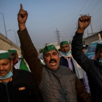 Farmers take part in a protest against recently passed farm bills at the Delhi-Uttar Pradesh border in Ghaziabad, India, on Wednesday.   |  REUTERS