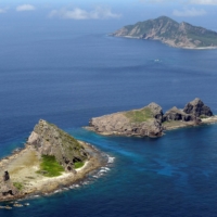 Japan, France and the United States will hold their first joint military drills on one of Japan\'s uninhabited outlying islands to counter China, a report says. | KYODO / VIA REUTERS