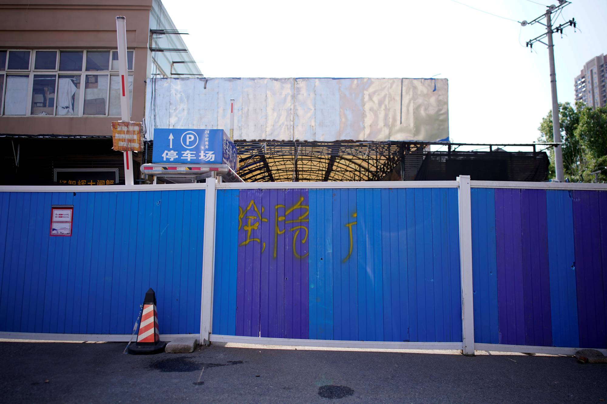A blocked entrance to Huanan seafood market in Wuhan, where COVID-19 is believed to have first surfaced. | REUTERS 