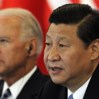 Then-Chinese Vice President Xi Jinping speaks next to then-U.S. Vice President Joe Biden during talks at a hotel in Beijing in August 2011. | POOL / VIA REUTERS