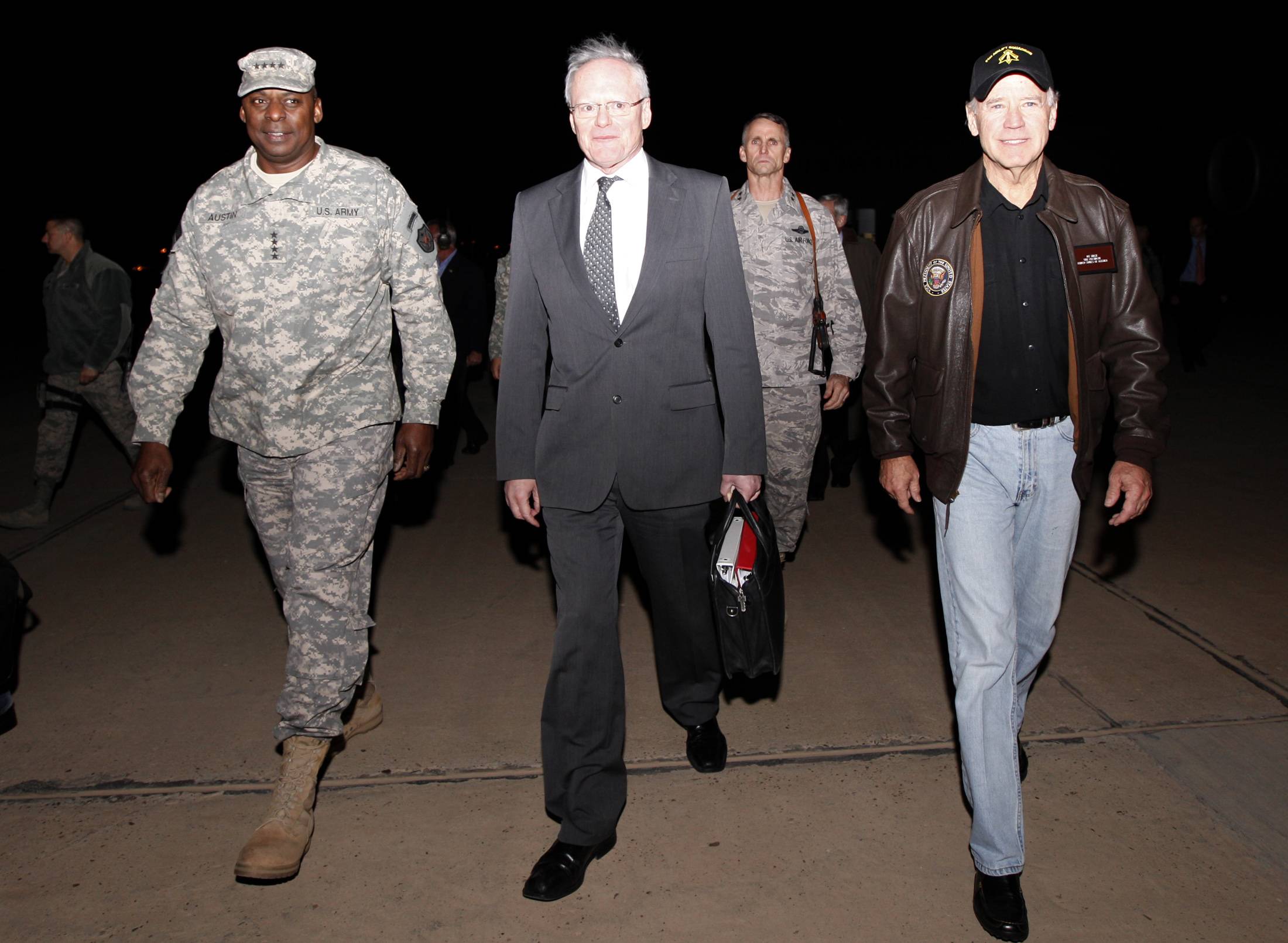 Then-U.S. Vice President Joe Biden is received by then-commander of the U.S. forces in Iraq, Gen. Lloyd Austin, and U.S. Ambassador to Iraq James Jeffrey in Baghdad in November 2011. | REUTERS
