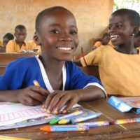 Ghanaian children attending school. ACE collaborates with a local NGO to protect the rights of children and provide access to education. | ACE
