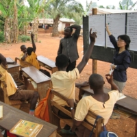 Ghanaian children attending school. ACE collaborates with a local NGO to protect the rights of children and provide access to education. | ACE