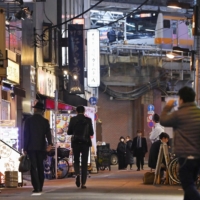 A street filled with restaurants and bars near Tokyo\'s Kanda Station is mostly quiet on Monday.  | KYODO