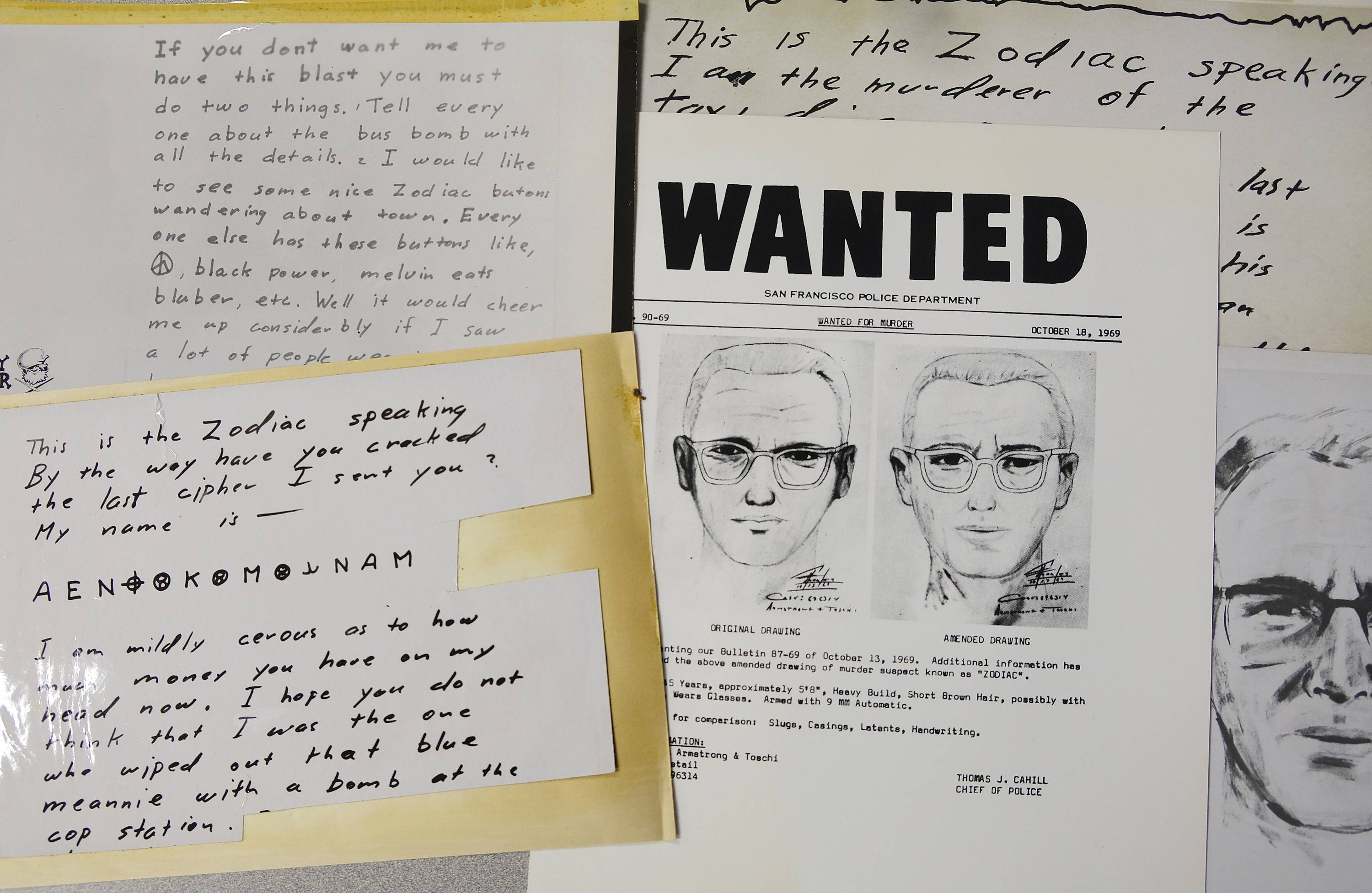 A San Francisco Police Department wanted bulletin and copies of letters sent to the San Francisco Chronicle by a man who called himself Zodiac are displayed in San Francisco. | AP