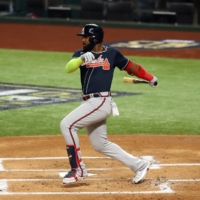 Braves designated hitter Marcell Ozuna hits an RBI single against the Dodgers during Game 7 of the NLCS in Arlington, Texas, on Oct. 18. | USA TODAY / VIA REUTERS