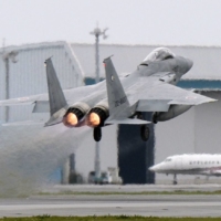 An F-15 fighter jet takes off at the Air Self Defense Force\'s Naha base in Okinawa Prefecture in April 2015. | KYODO