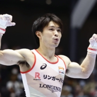 Kohei Uchimura poses after his horizontal bar performance during the national gymnastics championships on Sunday in Takasaki, Gunma Prefecture. | KYODO