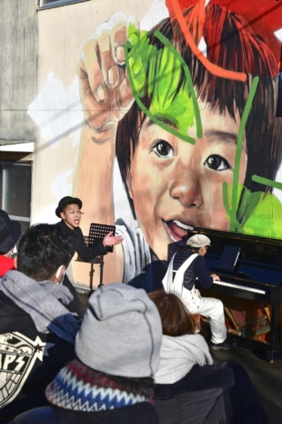 The two new murals in Futaba, Fukushima Prefecture, depict a boy at the time of the Fukushima No. 1 nuclear disaster and how he is in the present day. | KYODO