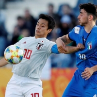 Japan\'s Mitsuki Saito contends for the ball with Italy\'s Roberto Alberico during their Under-20 World Cup match on May 29, 2019, in Bydgoszcz, Poland. | REUTERS