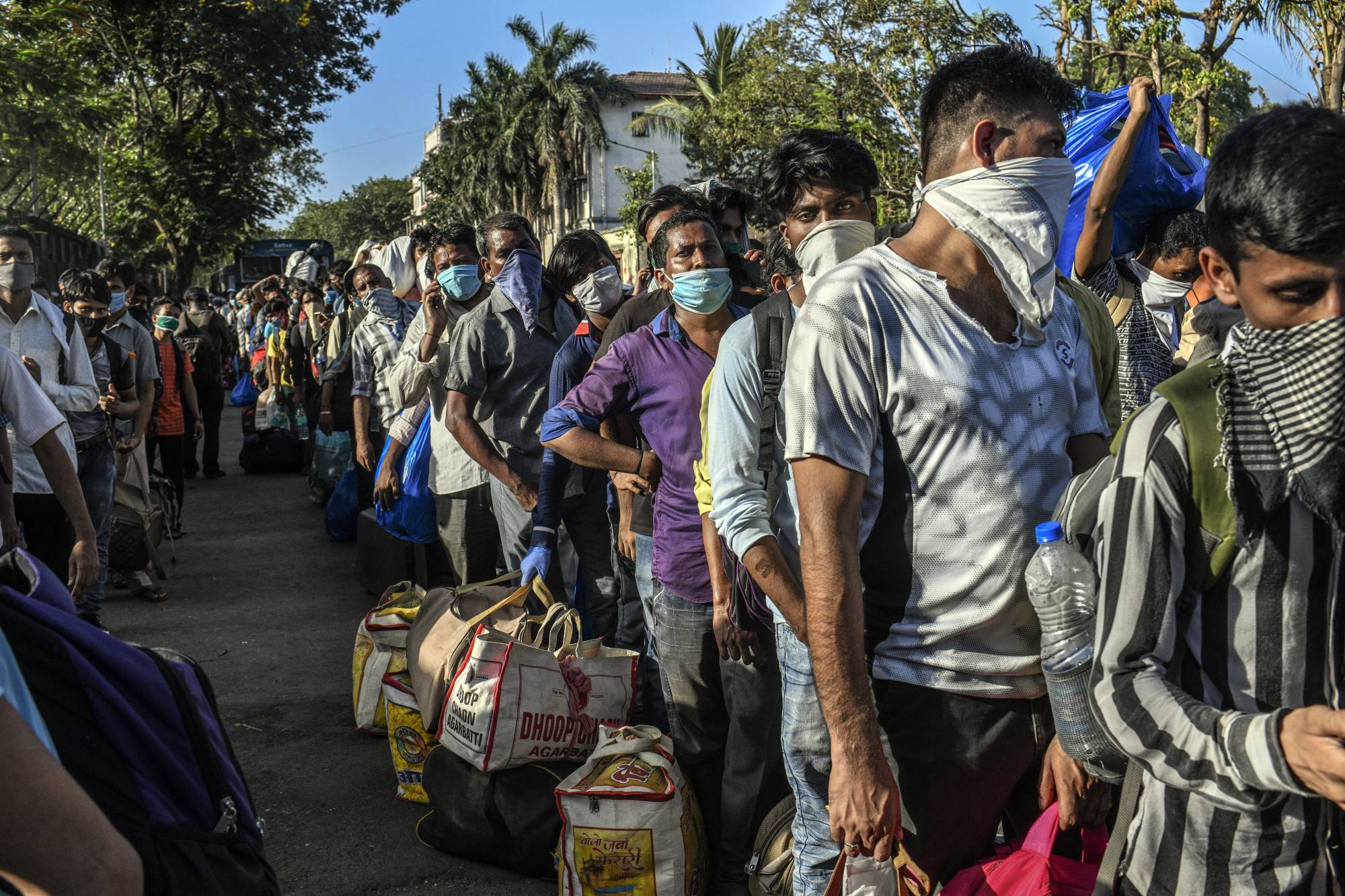 Migrant workers in Mumbai wait to board a train home to rural Bihar on May 20. | Atul Loke / The New York Times