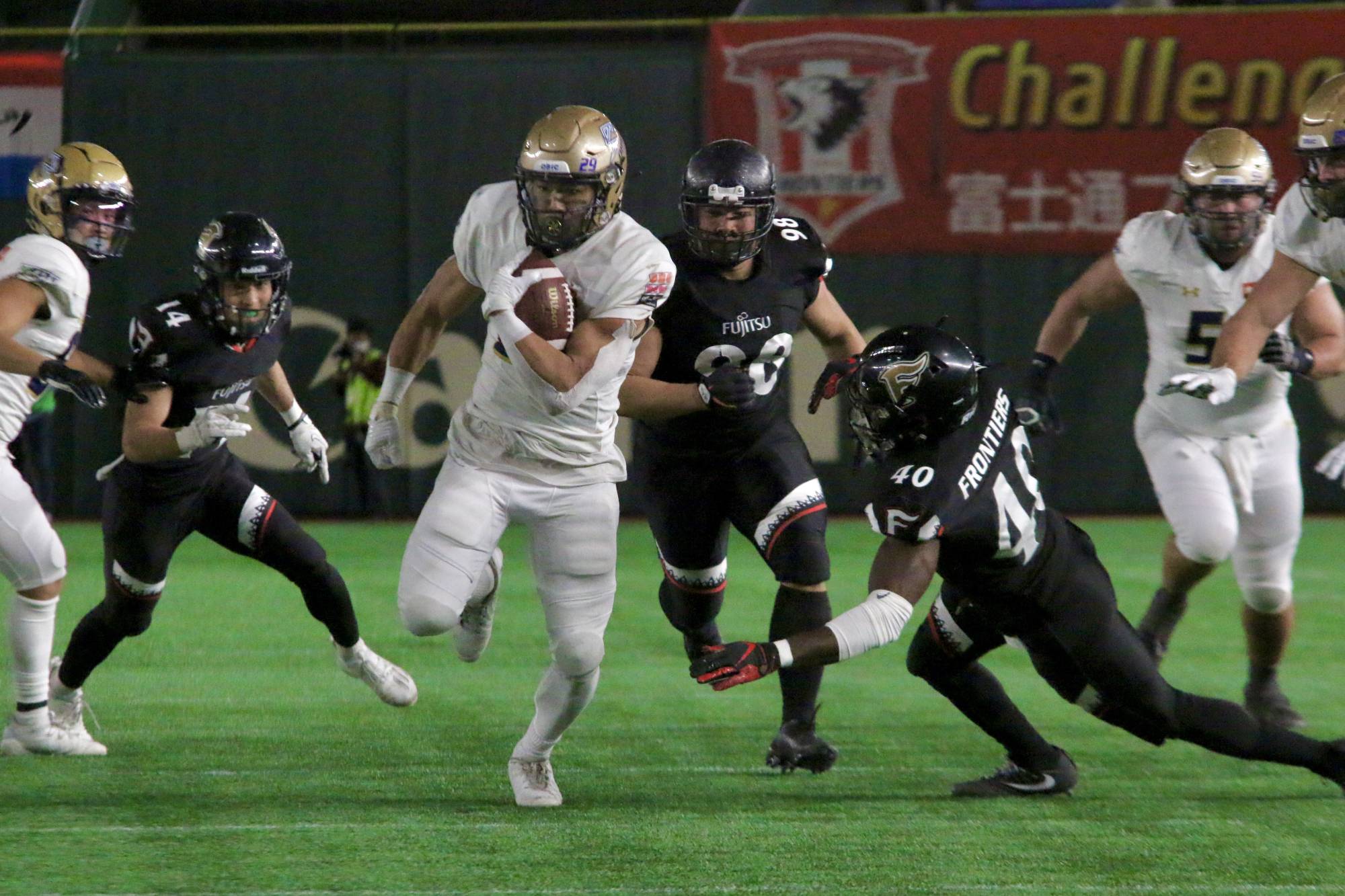 Seagulls running back Tak Lee carries the ball against the Frontiers during the Japan X Bowl on Tuesday at Tokyo Dome. | KAZ NAGATSUKA