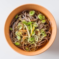 Comfort food: For a much simpler toshikoshi (“year-crossing”) soba, serve the noodles and soup topped with chopped leek or green onion, shredded yuzu citrus peel and shichimi tōgarashi spice mix. | MAKIKO ITOH
