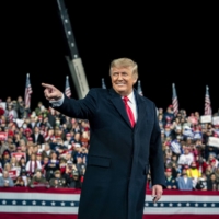 U.S. President Donald Trump appears at a campaign rally for Georgia\'s incumbent Republican senators, Kelly Loeffler and David Perdue, at an airport in Valdosta, Georgia, on Dec. 5. When Trump departs the White House, he will have a huge pile of cash to fuel his future ambitions. | DOUG MILLS/THE NEW YORK TIMES