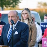 Lara Trump, U.S. President Donald Trump\'s daughter-in-law, looks on as Rudy Giuliani, the president\'s attorney, speaks at a news conference in Philadelphia on Nov. 4. She served as a senior campaign adviser and surrogate to Trump.   | GABRIELA BHASKAR/THE NEW YORK TIMES