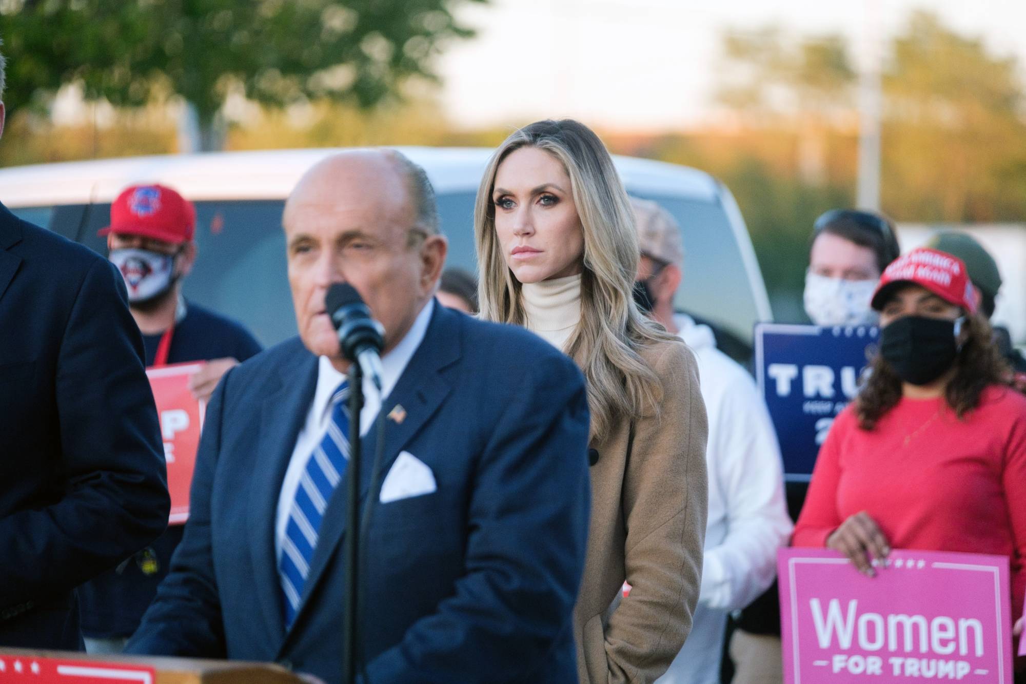 Lara Trump, U.S. President Donald Trump's daughter-in-law, looks on as Rudy Giuliani, the president's attorney, speaks at a news conference in Philadelphia on Nov. 4. She served as a senior campaign adviser and surrogate to Trump. | Gabriela Bhaskar/The New York Times