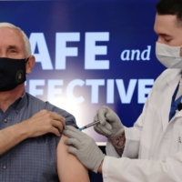 U.S. Vice President Mike Pence receives a COVID-19 vaccine at the White House in Washington on Friday. | REUTERS