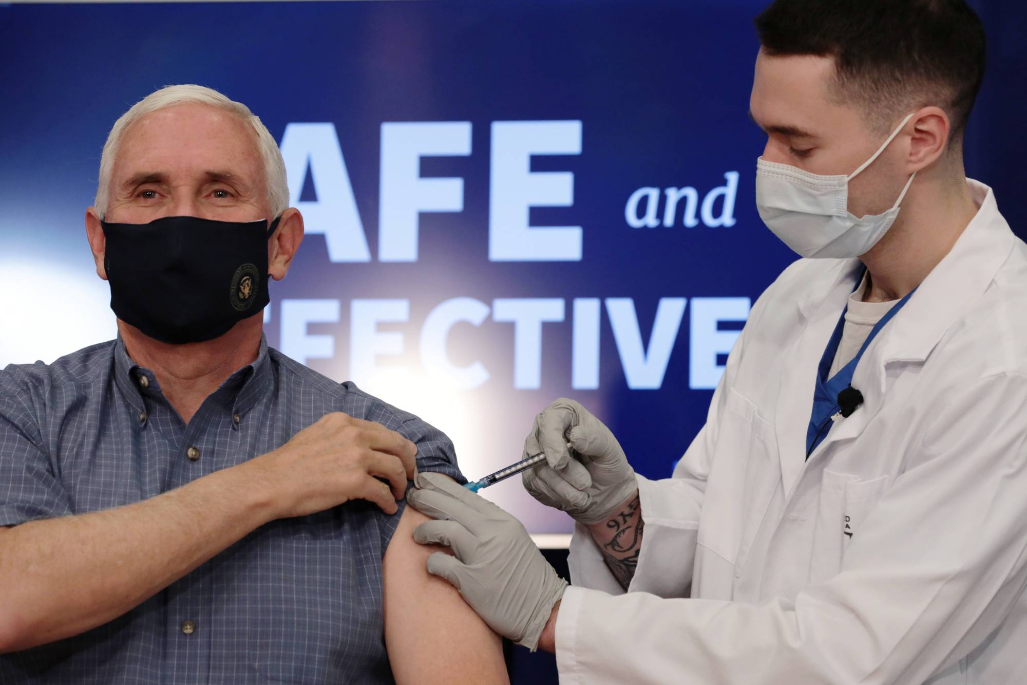 U.S. Vice President Mike Pence receives a COVID-19 vaccine at the White House in Washington on Friday. | REUTERS