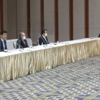 Defense Minister Nobuo Kishi (second from left, front) speaks at a meeting with executives of the Japan Business Federation in Tokyo on Thursday. | KYODO