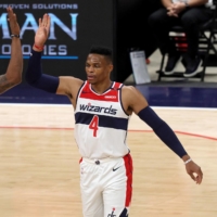 The Wizards\' Bradley Beal (left) and Russell Westbrook celebrate after Beal scored and was fouled in the first half against the Pistons during Saturday\'s preseason game in Washington. | POOL / VIA USA TODAY / VIA REUTERS