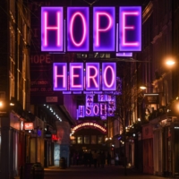 Festive lights hang over an otherwise quiet Carnaby Street in London on Sunday. | GETTY IMAGES / VIA BLOOMBERG 