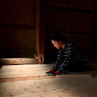 DIY: Nobuko Caudron renovates the floor of the brewery, which is scheduled to open in autumn 2021. | COURTESY OF KOHACHI BEERWORKS
