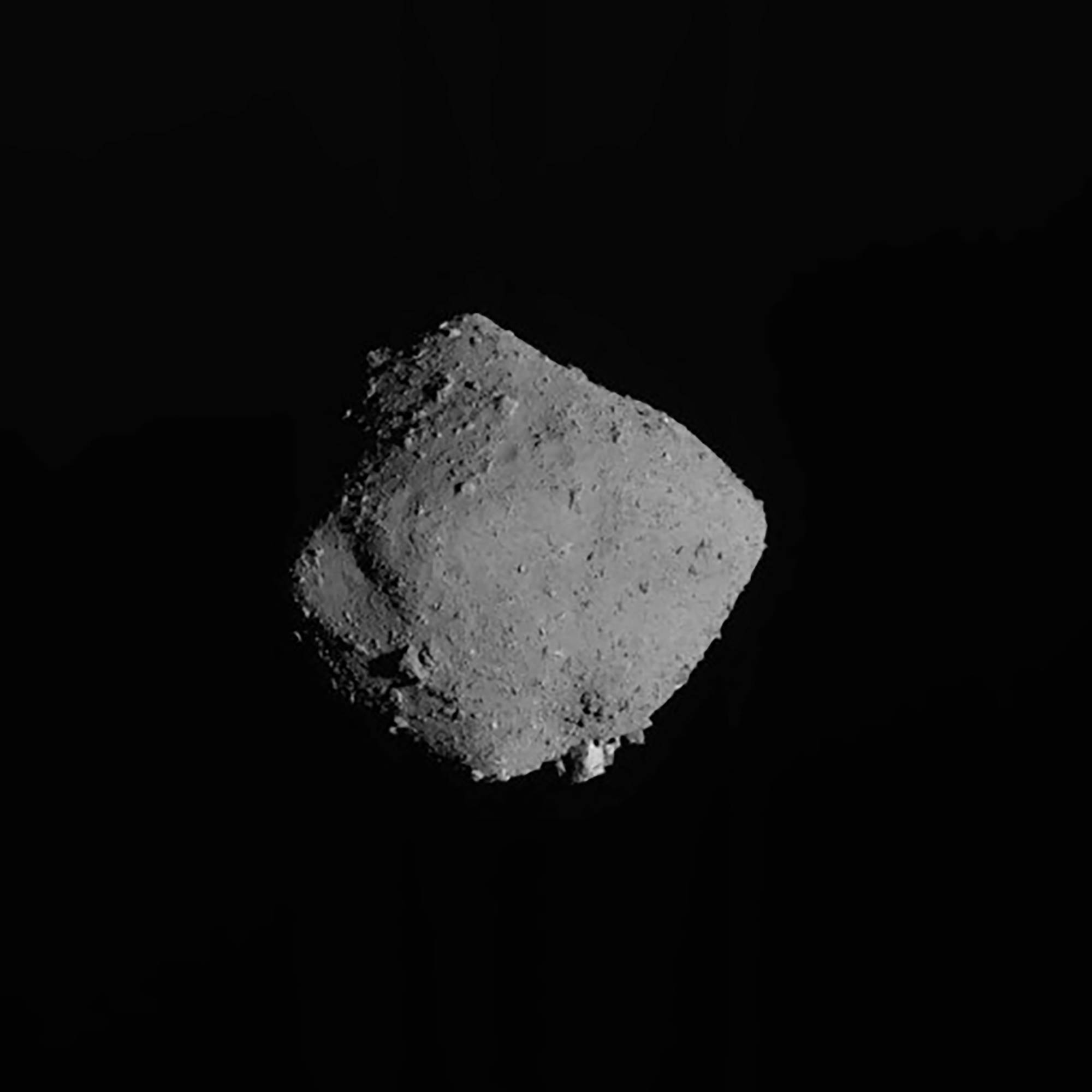 The asteroid Ryugu taken by its Hayabusa2 spacecraft. The spacecraft spent six years at a cost of $157 million to recover a single gram of material from the asteroid and return it to Earth recently. | AXA / VIA AP